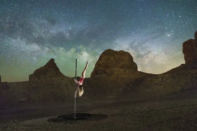 These stunning images show a group of aerial artists lighting up the night sky. Taken by photographer Casey Grimley, 37, the photos show pole dancers and aerial artists at various locations in Southern California, including the famed Joshua Tree National Park. Casey said that the images required thousands of hours of demanding rehearsals by each of the dancers. (Photo by Casey Grimley/Caters News Agency)