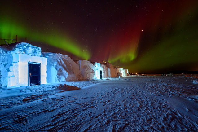 A view of the backside of Icehotel 34 with the Northern Lights or Aurora Borealis over it on December 16, 2023 in Jukkasjarvi, Sweden. Since 1989, the Icehotel – part hotel, part art exhibition – has been crafted annually from ice taken from the Torne River. (Photo by Roy Rochlin/Getty Images)