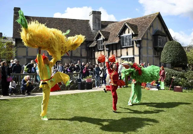 Chinese performers cast shadows on the lawn outside the house where William Shakespeare was born during celebrations to mark the 400th anniversary of the playwright's death in  Stratford-Upon-Avon, Britain, April 23, 2016. (Photo by Dylan Martinez/Reuters)