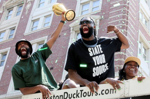 Boston Celtics guard Jaylen Brown (7) holds up the MVP trophy at the Boston Celtics championship duck boat parade on June 21, 2024. (Photo by Lauren Owens Lambert/Reuters)