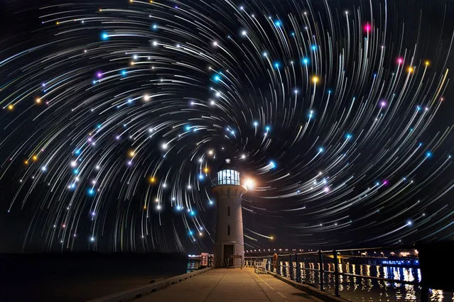 Star trails photographed by Justin Ng seen behind a lighthouse in Tuas, Singapore. These astonishing images of night sky are captured by Singapore based photographer Justin Ng. The pictures were taken between November 2013 to January 2014. It show's star trail caused by the earth's rotation and also can be achieved by zooming the DSLR lens inward or outward in small steps using a dedicated motorized zooming device. (Photo by  Justin Ng/Barcroft Media)