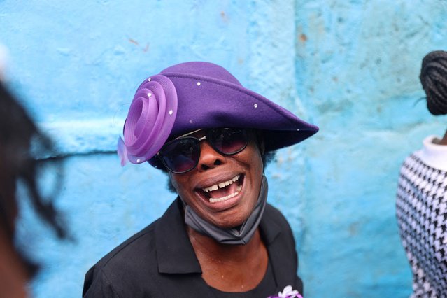 A woman reacts during the funeral of Judes Montis, a Christian missionary worker from Missions who was shot and killed by gang members along with fellow missionaries Natalie and Davy Lloyd, in Port-au-Prince, Haiti on May 28, 2024. (Photo by Ralph Tedy Erol/Reuters)