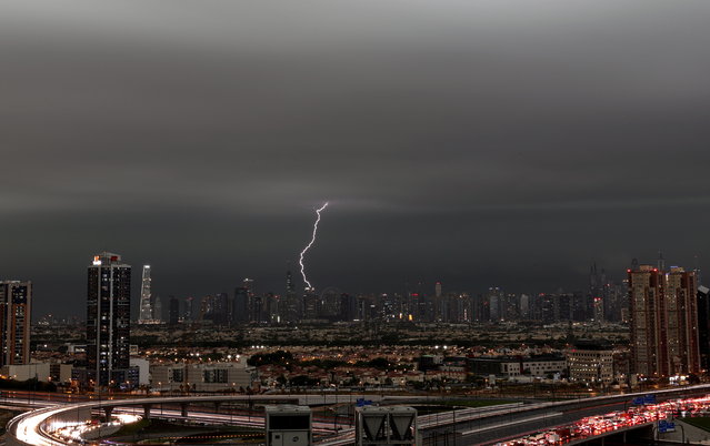 A lightning flashes through the sky during a heavy rainfall in Dubai, United Arab Emirates, 16 April 2024. A severe wave of thunderstorms with heavy rainfall is hitting most UAE's cities especially in Dubai, Sharjah and Al Ain where the Asian Champions League semi final first leg match between UAE's Al-Ain Club and Al-Hilal from Saudi Arabia has been postponed. (Photo by Ali Haider/EPA)