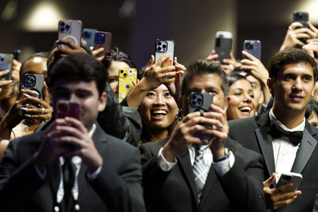 Guests take pictures as US President Joe Biden delivers remarks at the Congressional Hispanic Caucus Institute 47th Annual Awards Gala in Washington, DC, USA, 19 September 2024. (Photo by Yuri Gripas/EPA/EFE/Rex Features/Shutterstock)