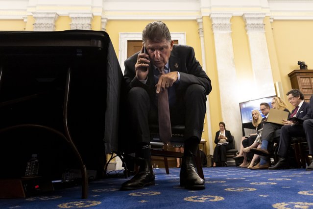 Democratic Senator from West Virginia Joe Manchin takes a call moments before appearing before the Senate Rules and Administration hearing to examine the Electoral Count Act, on Capitol Hill in Washington, DC, USA, 03 August 2022. The health care and climate bill known as the Inflation Reduction Act is a plan created through a compromise between Senate Democratic leadership and Democratic Senator from West Virginia Joe Manchin. (Photo by Michael Reynolds/EPA/EFE)