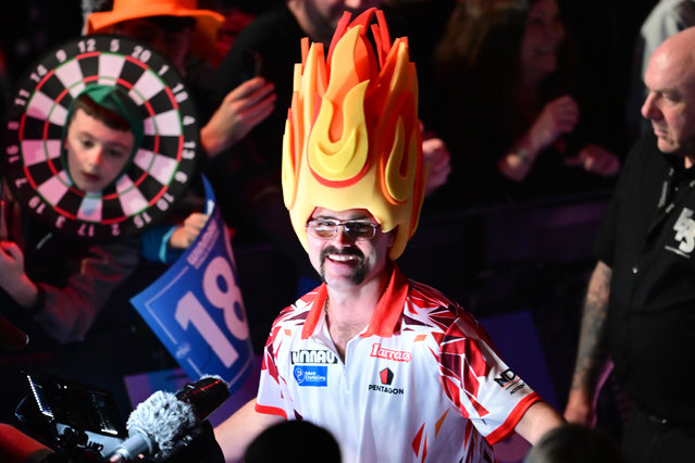 Damon Heta walks on wearing flame headgear during the Winmau World Masters Darts 2025 at Marshall Arena, Milton Keynes, UK on February 2, 2025. (Photo by Dennis Goodwin/ProSports/Rex Features/Shutterstock)
