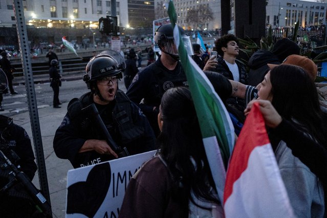 Police officers confront protestors during a rally against the arrests and deportations of migrants by U.S. government agencies in Los Angeles, California, U.S. February 3, 2025. (Photo by Joel Angel Juarez/Reuters)