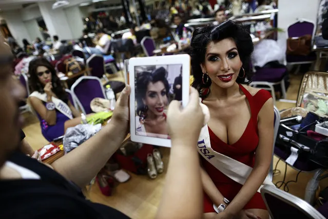 Sunny Dee-Lite, a contestant from the U.S., gets her picture taken before the start of the final night of Miss International Queen 2012 transgender/transsexual beauty pageant in Pattaya November 2, 2012. Some 21 contestants from 15 countries, all of them born male, compete in the week-long event for the crown of Miss International Queen 2012