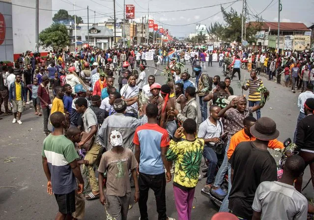 Anti-Rwanda protesters march towards the border of the Democratic Republic of Congo and Rwanda in Goma, on October 31, 2022. Thousands of anti-Rwanda protesters marched through the eastern DR Congo city of Goma on October 31, 2022, as M23 rebels tightened their grip on the surrounding countryside.  A mostly Congolese Tutsi group, the M23 resumed fighting in late 2021 after lying dormant for years, accusing the Democratic Republic of Congo's government of failing to honour an agreement to integrate its fighters into the army. The group's resurgence has destabilised regional relations in central Africa, with the DRC accusing its smaller neighbour Rwanda of backing the militia. (Photo by Michel Lunanga/AFP Photo)