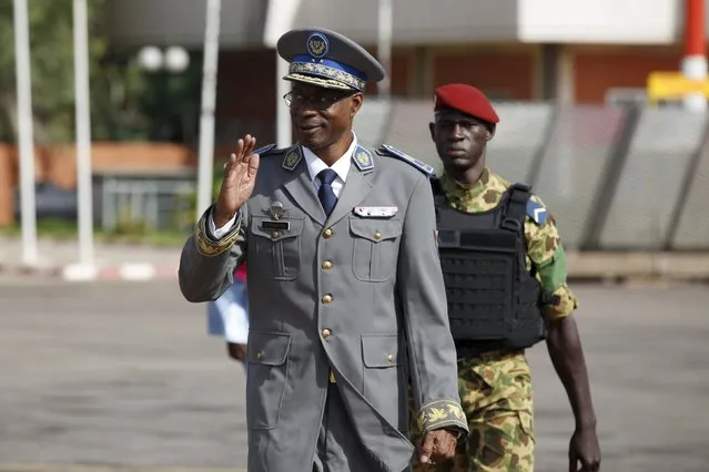 Burkina Faso's coup leader General Gilbert Diendere arrives at the airport to greet foreign heads of state in Ouagadougou, Burkina Faso, September 23, 2015. Following an emergency summit of the regional bloc ECOWAS in Nigeria on Tuesday, the presidents of Senegal, Togo, Benin, Ghana, Niger and Nigeria were to travel Burkina Faso on Wednesday to ensure that President Michel Kafando is reinstalled. (Photo by Joe Penney/Reuters)