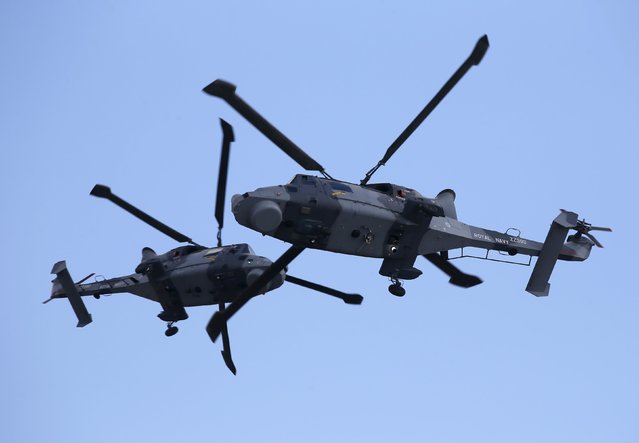 AgustaWestland Wildcat HMA.2 helicopters of the Black Cats Helicopter Display Team, of the British Royal Navy Fleet Air Arm, take part in a display during the Malta International Airshow at Malta International Airport, outside Valletta, Malta, September 27, 2015. (Photo by Darrin Zammit Lupi/Reuters)