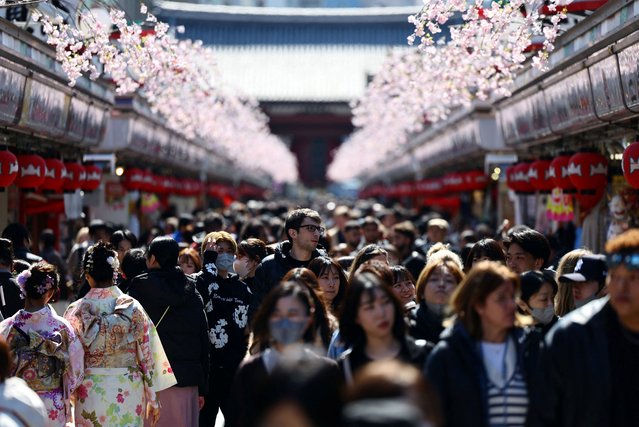 Visitors walk along Nakamise-dori street as they visit Sensoji temple at Asakusa district, a popular sightseeing spot in Tokyo, Japan on March 10, 2025. (Photo by Issei Kato/Reuters)