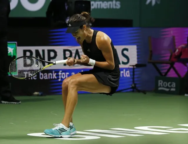 Ana Ivanovic of Serbia celebrates her win over Eugenie Bouchard of Canada during their WTA Finals singles tennis match at the Singapore Indoor Stadium October 22, 2014. (Photo by Edgar Su/Reuters)
