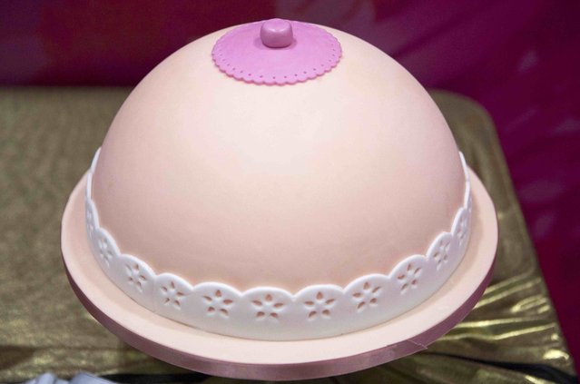 A cake decorated like a breast is displayed at the Cake and Bake show in London, Britain October 3, 2015. (Photo by Neil Hall/Reuters)