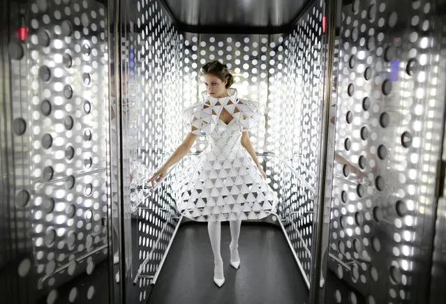 Spanish model, Raquel Bonilla, 22, poses inside an elevator as she wears a creation by Myriam Hurtado during an urban photo shooting part of the Andalucia de Moda (Andalusia Fashion) in Seville, southern Spain, November 4, 2014. (Photo by Marcelo del Pozo/Reuters)