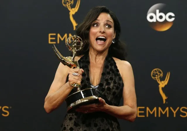 Actress Julia Louis-Dreyfus poses backstage with her award for Outstanding Lead Actress In A Comedy Series for her role in HBO's “Veep” at the 68th Primetime Emmy Awards in Los Angeles, California U.S., September 18, 2016. (Photo by Mario Anzuoni/Reuters)