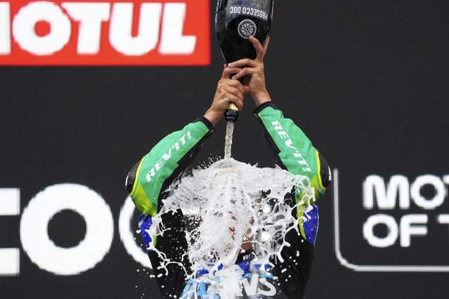 Brazil's rider Diogo Moreira of the Italtrans Racing Team celebrates on the podium after winning the Moto2 race at the Grand Prix of the Netherlands at the TT Circuit in Assen, northern Netherlands, Sunday, June 29, 2025. (Photo by Peter Dejong/AP Photo)