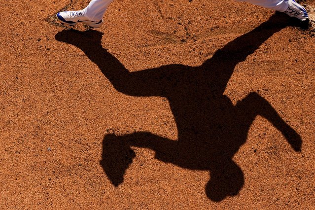 Kansas City Royals starting pitcher Cole Ragans casts a shadow in the bullpen while warming up before facing the Athletics in a spring training baseball game Monday, February 24, 2025, in Goodyear, Ariz. (Photo by Ashley Landis/AP Photo)