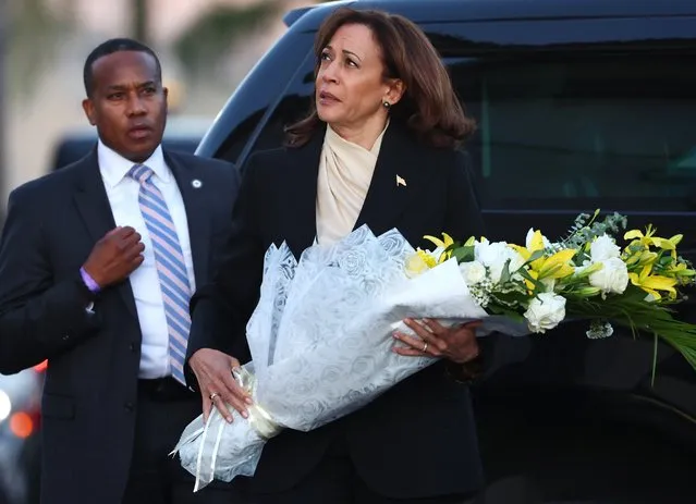 U.S. Vice President Kamala Harris walks to lay flowers at the memorial outside the Star Ballroom Dance Studio where a deadly mass shooting took place on January 25, 2023 in Monterey Park, California. Eleven people died and nine more were injured at the studio near a Lunar New Year celebration last Saturday night. Harris also was scheduled to meet with families of victims in the predominantly Asian American community of Monterey Park. (Photo by Mario Tama/Getty Images)