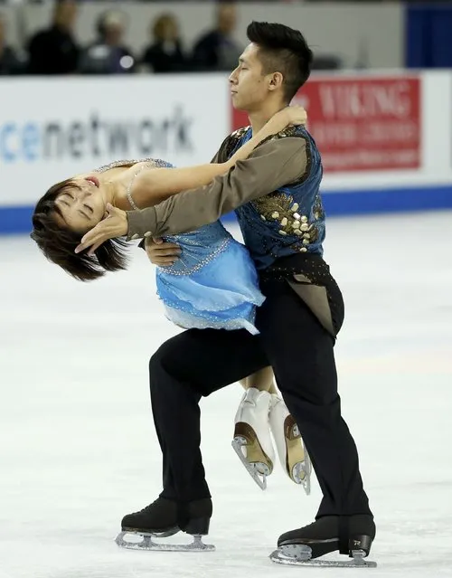 Sui Wenjing and Han Cong of China perform during the pairs free skate program at the Skate America figure skating competition in Milwaukee, Wisconsin October 24, 2015. (Photo by Lucy Nicholson/Reuters)