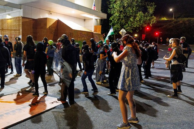 People dance in front of the ICE building during a protest against Trump's immigration policies, outside an ICE detention facility in Portland, Oregon, U.S., on September 1, 2025. (Photo by John Rudoff/Reuters)