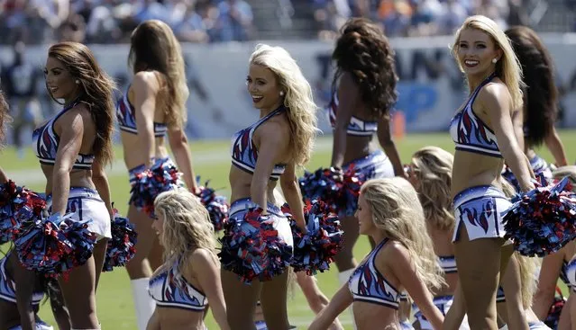 Tennessee Titans cheerleaders perform in the first half of an NFL football game between the Titans and the Oakland Raiders Sunday, September 25, 2016, in Nashville, Tenn. (Photo by James Kenney/AP Photo)