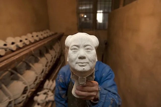 A worker makes a bronze statue of China's late Chairman Mao Zedong at a factory in Shaoshan, Hunan province, December 7, 2014. Friday, December 26, 2014 will mark the121st birth anniversary of Mao. (Photo by Darwin Zhou/Reuters)