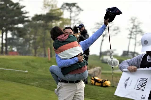 Spain's Pablo Larrazabal celebrates with his girlfriend Adriana Lamelas after winning the Korea Championship presented by Genesis at the Jack Nicklaus Golf Club Korea, in Incheon, South Korea, Sunday, April 30, 2023. (Photo by Lee Jin-man/AP Photo)