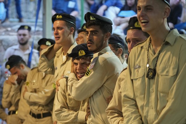 Israeli Navy sailors mourn during the funeral of Petty Officer 1st Class David Moshe Ben Shitrit, who was killed in a Hezbollah attack, at the Mount Herzl military cemetery in Jerusalem, August 25, 2024. (Photo by Ohad Zwigenberg/AP Photo)
