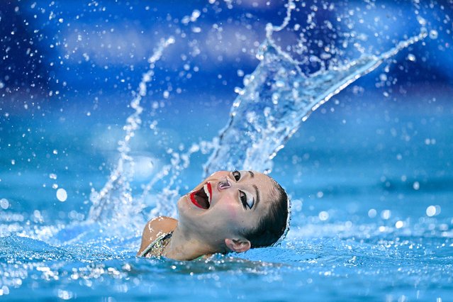 Japan's Moe Higa and Japan's Tomoka Sato compete in the duet free routine of the artistic swimming event during the Paris 2024 Olympic Games at the Aquatics Centre in Saint-Denis, north of Paris, on August 10, 2024. (Photo by Oli Scarff/AFP Photo)