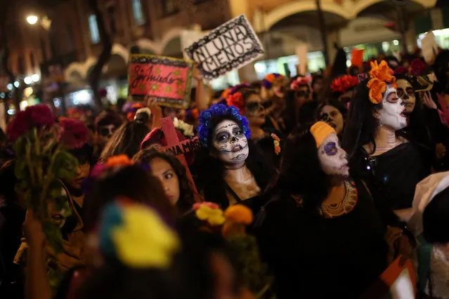 Activists with their faces painted to look like popular Mexican figure “Catrina” take part in a march against femicides during the Day of the Dead in Mexico City, Mexico, November 1, 2016. (Photo by Edgard Garrido/Reuters)