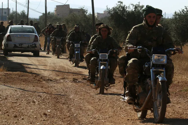 Rebel fighters drive their motorcycles, western Aleppo city, Syria November 3, 2016. (Photo by Ammar Abdullah/Reuters)
