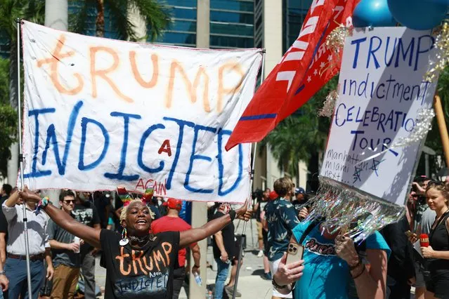 Vocal Trump opponent Nabine Seiler holds a sign that reads “Trump Indicted Again” outside the Wilkie D. Ferguson Jr. United States Federal Courthouse where former President Donald Trump is scheduled to be arraigned later in the day on June 13, 2023 in Miami, Florida. Trump is scheduled to appear in the federal court for his arraignment on charges including possession of national security documents after leaving office, obstruction, and making false statements.  (Photo by Joe Raedle/Getty Images)
