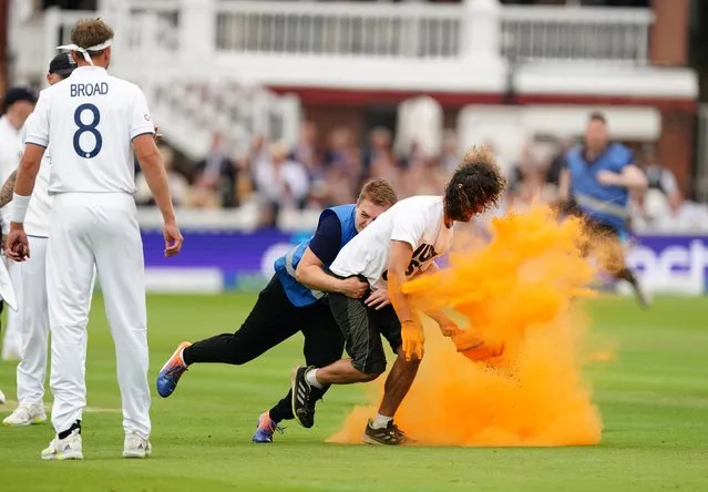 Security grab a Just Stop Oil protester during day one of the second Ashes test match at Lord's, London on Wednesday, June 28, 2023. (Photo by Mike Egerton/PA Images via Getty Images)