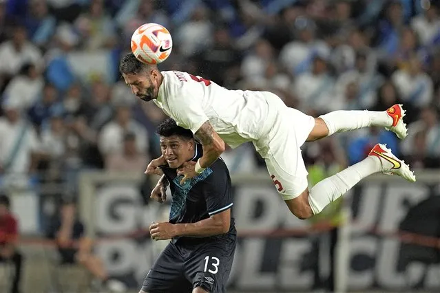 Canada's Steven Vitória (5) leaps over Guatemala's Alejandro Galindo (13) during the second half of a CONCACAF Gold Cup soccer match Saturday, July 1, 2023, in Houston. (Photo by David J. Phillip/AP Photo)