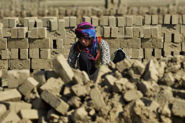 A Pakistani labourer makes bricks at a factory on the outskirts of Lahore on Marchi 7, 2016, ahead of International Women's Day. Women in Pakistan have fought for their rights for decades, in a country where so-called honour killings and acid attacks remain commonplace. (Photo by Arif Ali/AFP Photo)