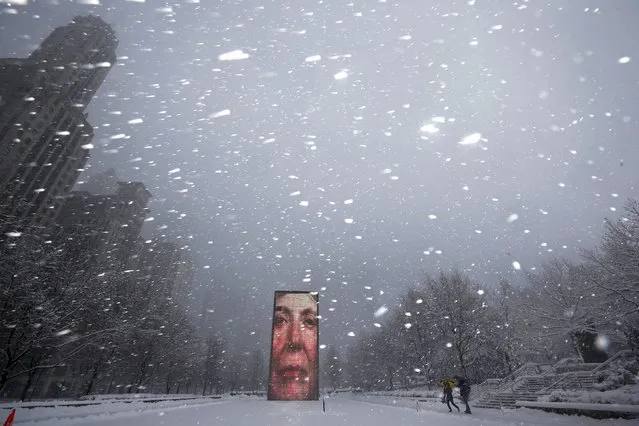 Two men walk past the Crown Fountain in blizzard conditions in Chicago, Illinois, United States February 1, 2015. (Photo by Jim Young/Reuters)