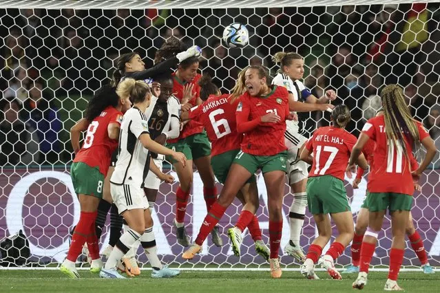 Morocco's goalkeeper Khadija Er-Rmichi tries to punch the ball away as players collide in front of the Moroccan net, leading to an own goal, during the Women's World Cup Group H soccer match between Germany and Morocco in Melbourne, Australia, Monday, July 24, 2023. (Photo by Victoria Adkins/AP Photo)