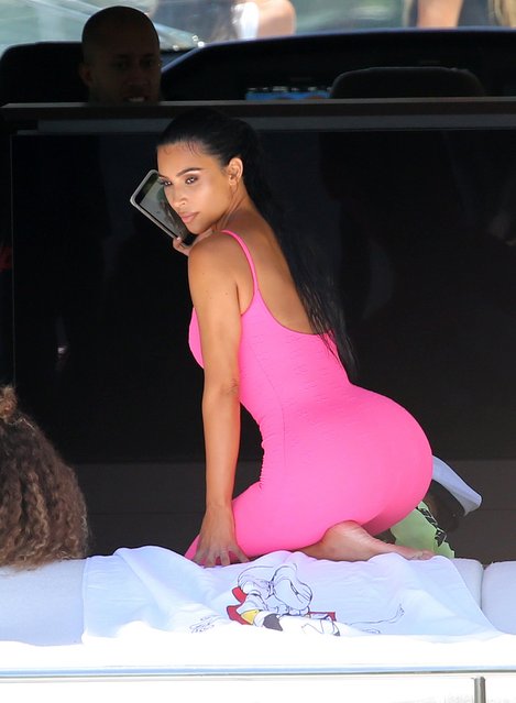 Kim Kardashian wears a pink Chanel catsuit as she takes her children North and Saint on Dave Grumman's new yacht in Miami on August 16, 2018. (Photo by The Mega Agency)