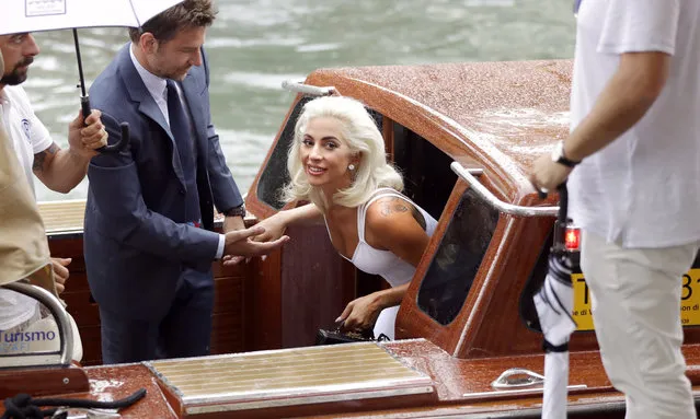 Singer and actress Lady Gaga, right, and actor Bradley Cooper arrive for the photo call of the film “A Star Is Born” at the 75th edition of the Venice Film Festival in Venice, Italy, Friday, August 31, 2018. (Photo by Kirsty Wigglesworth/AP Photo)