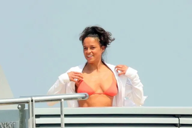 Michelle Rodriguez shows off her bikini body as she soaks in the sun during her vacation in the last decade of July 2023.  The Fast And Furious actress was spotted playing with a basketball and relaxing on a yacht in Porto Cervo, Sardinia. (Photo by Ciao Pix/Shutterstock/Splash News and Pictures)