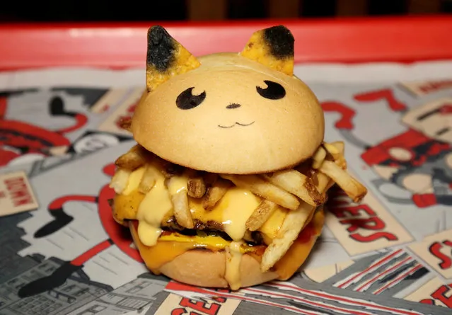 A “Pokeburg” hamburger with the name 'Peakachu, inspired by the Pokemon Go phenomenon, is pictured at Down N' Out Burger restaurant in Sydney, Australia, August 26, 2016. The restaurant sells a limited number of Pokeburgs per day, with the names Chugmander, Peakachu and Bulboozaur, capitalizing on fans' appetite for Pokemon Go, the location-based augmented reality game. (Photo by Jason Reed/Reuters)
