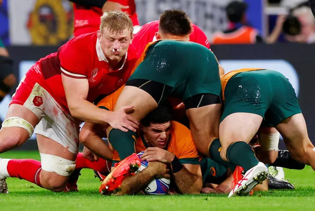 Australia's Ben Donaldson in action with Wales' Jac Morgan during the Rugby World Cup 2023 in Lyon, France on September 24, 2023. (Photo by Gonzalo Fuentes/Reuters)