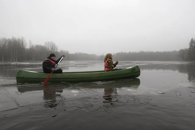 People canoe on a flooded meadow in Soomaa national park, Estonia, February 7, 2016. (Photo by Ints Kalnins/Reuters)