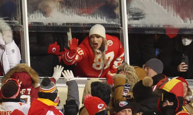 The singer Taylor Swift celebrates with fans during the AFC Wild Card Playoffs between the Miami Dolphins and the Kansas City Chiefs at GEHA Field at Arrowhead Stadium on January 13, 2024 in Kansas City, Missouri. (Photo by Jamie Squire/Getty Images)