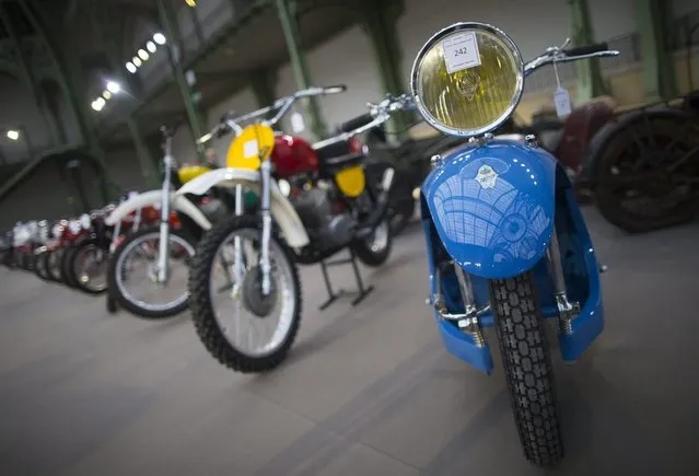 Classic motorcycles are displayed during a press preview before a mass auction of vintage vehicles organised by Bonhams auction house as part of “Retromobile Week” at the Grand Palais in Paris, France, 05 February 2014. (Photo by Ian Langsdon/EPA)