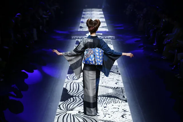 A model presents a creation by Jotaro Saito from the designer's Autumn/Winter 2016 collection during Tokyo Fashion Week in Tokyo, Japan, March 16, 2016. (Photo by Thomas Peter/Reuters)