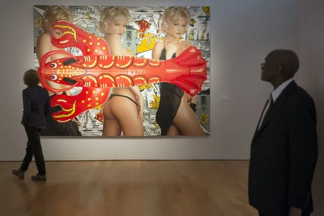 A man looks at Jeff Koons' “Triple Elvis” ahead of a preview event to Christie's upcoming impressionist, modern and contemporary art sale in the Manhattan borough of New York May 1, 2015. With prices for top-tier works of art at an all-time high, records for paintings and sculpture appear certain to fall at upcoming spring auctions in New York by Christie's and Sotheby's. (Photo by Darren Ornitz/Reuters)