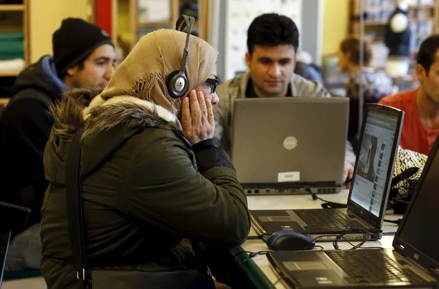 Migrants learn German on laptops at the community centre “SPIKE Dresden” in Dresden, Germany, March 22, 2016. (Photo by Ina Fassbender/Reuters)