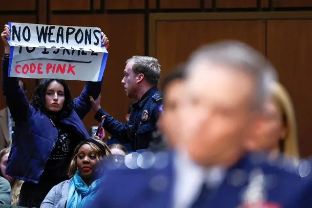 A protester is removed from a Senate Intelligence Committee hearing on worldwide threats to American security, on Capitol Hill in Washington on March 11, 2024. (Photo by Julia Nikhinson/Reuters)